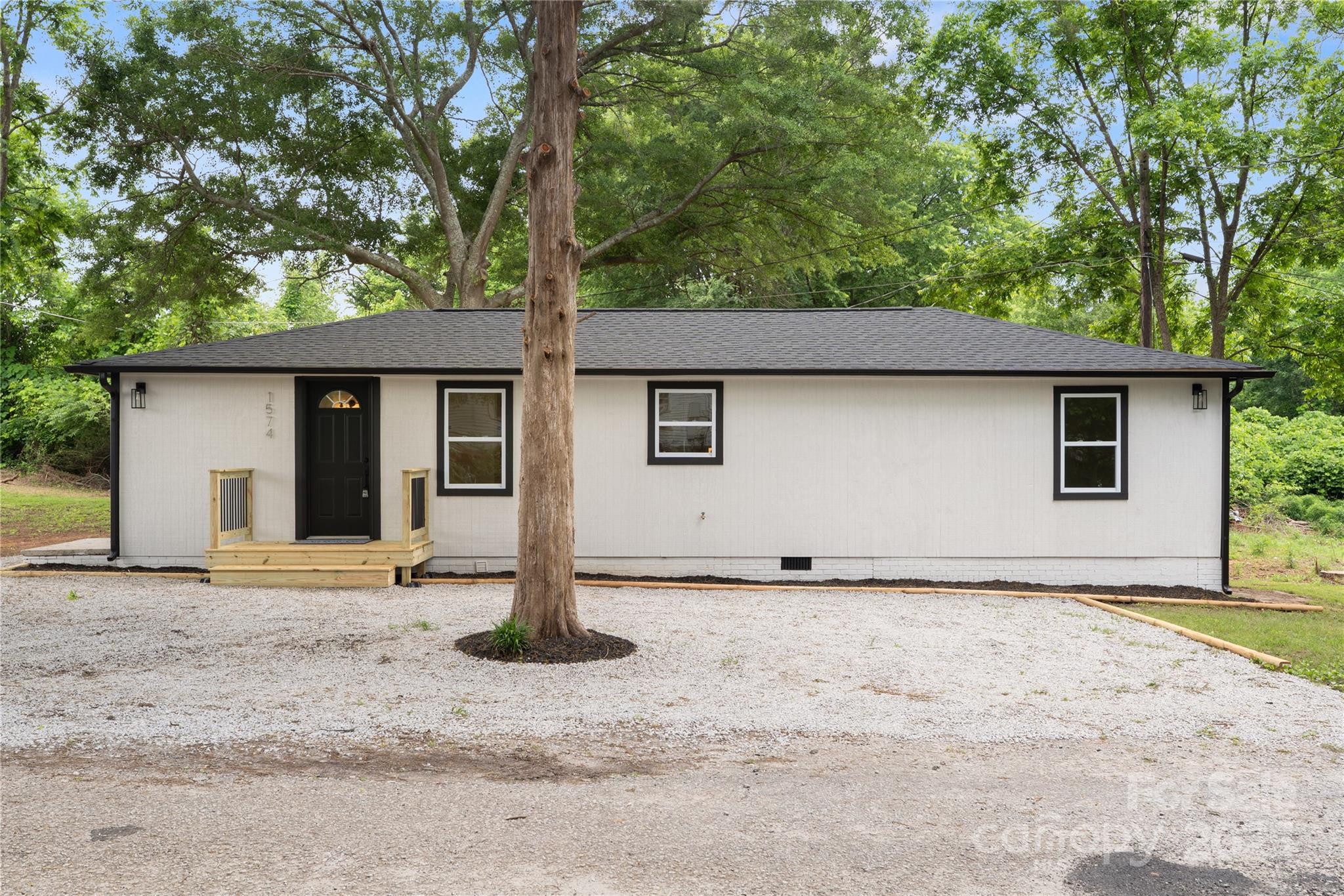 1574 Mangum Drive Lancaster, SC 29720 - Photo 1 of 22 a house with a tree in front of it