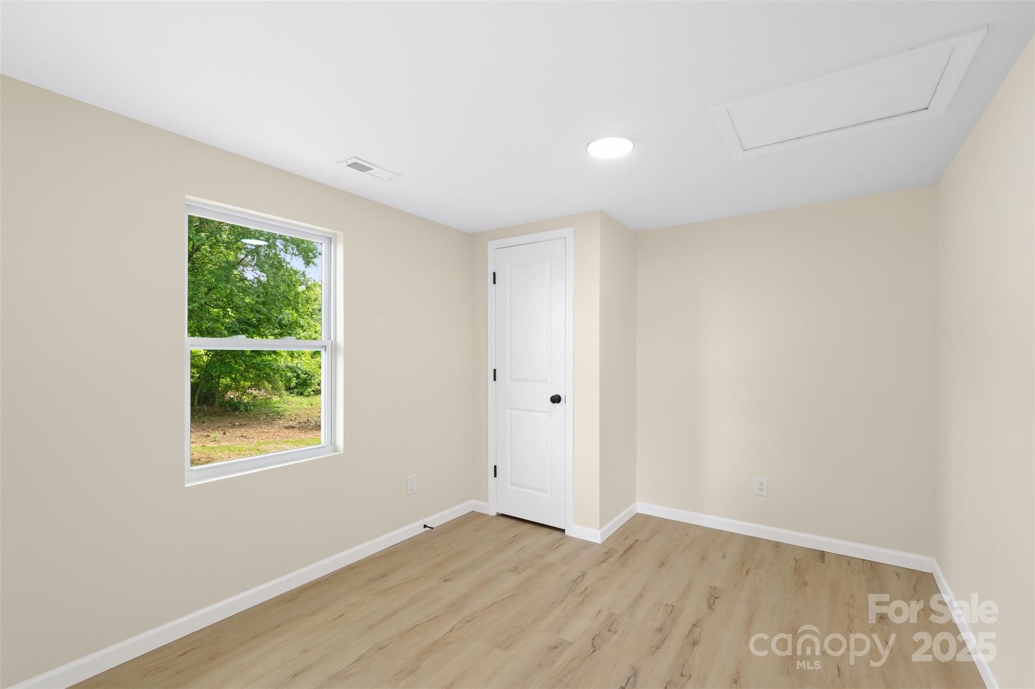 1574 Mangum Drive Lancaster, SC 29720 - Photo 14 of 22 a view of an empty room with wooden floor and a window