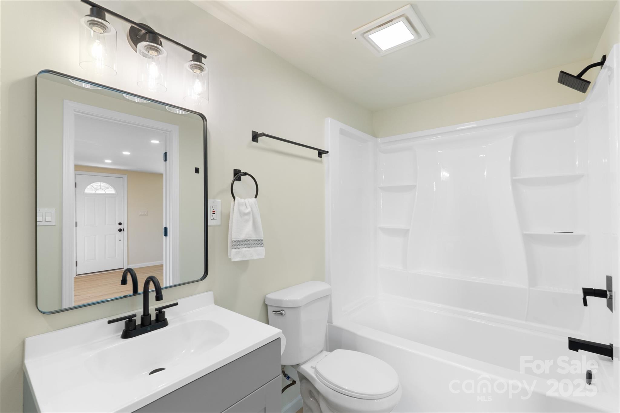 1574 Mangum Drive Lancaster, SC 29720 - Photo 19 of 22 a bathroom with a bathtub shower sink mirror vanity and toilet