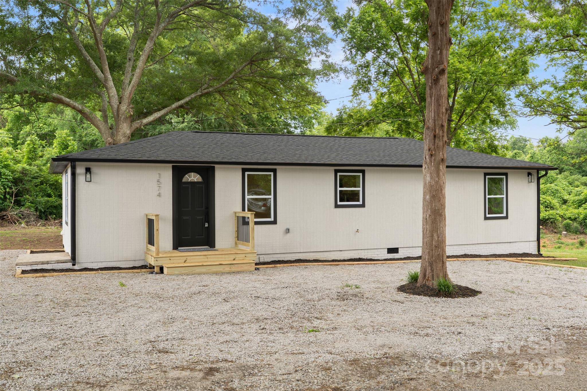 1574 Mangum Drive Lancaster, SC 29720 - Photo 2 of 22 a house with trees in the background