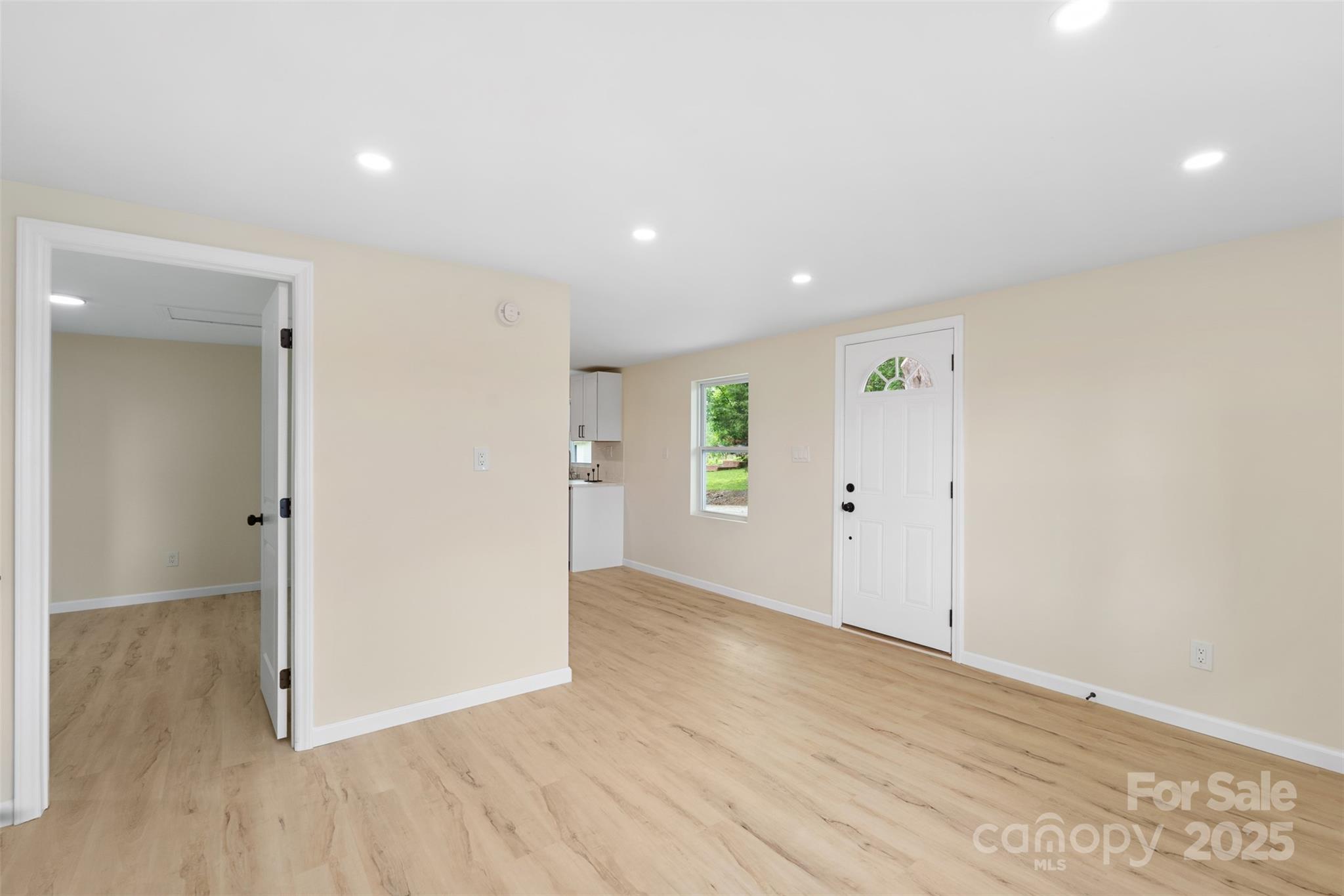 1574 Mangum Drive Lancaster, SC 29720 - Photo 4 of 22 an empty room with wooden floor & windows