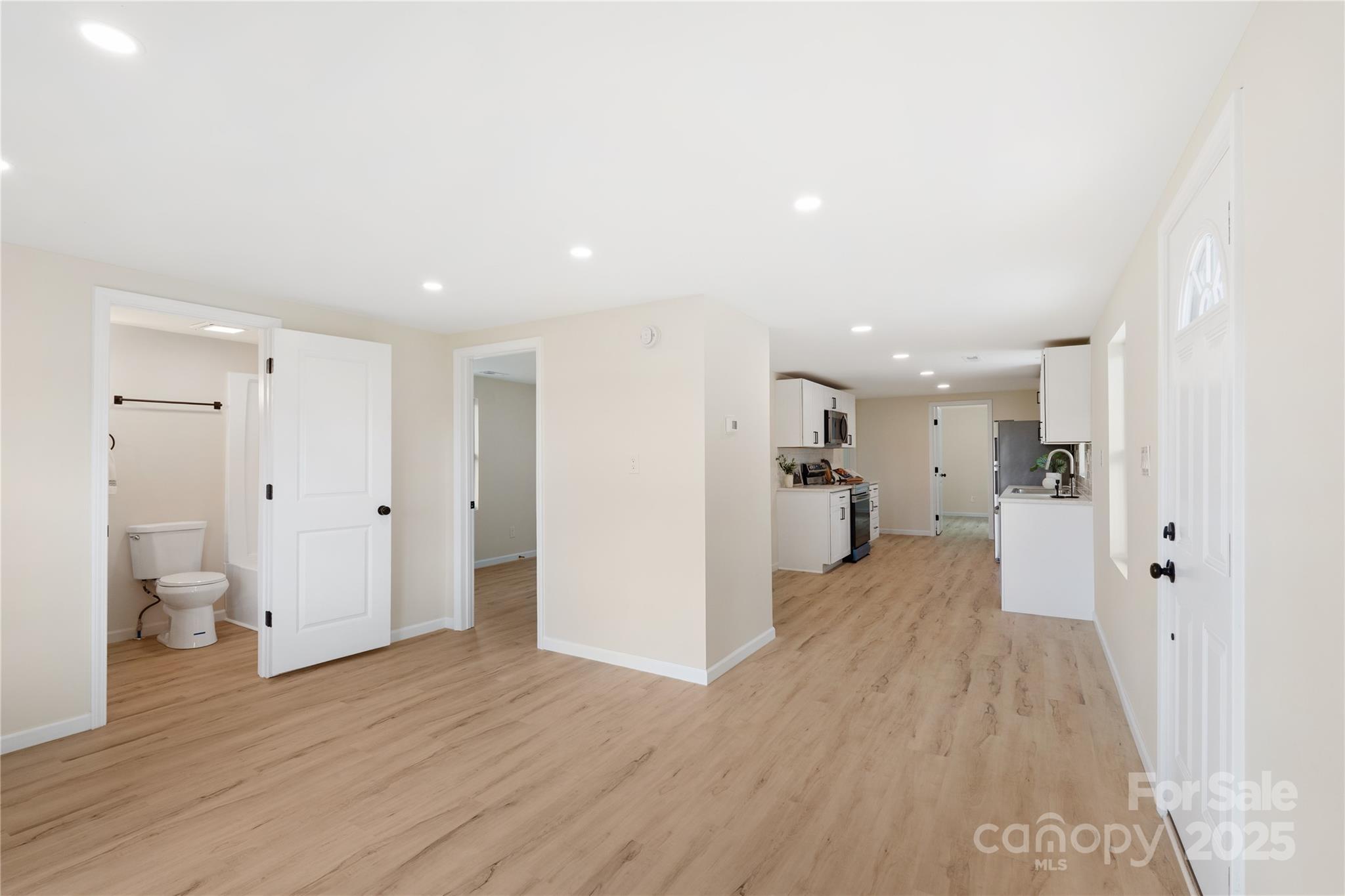 1574 Mangum Drive Lancaster, SC 29720 - Photo 7 of 22 a view of a big room with wooden floor and a bathroom