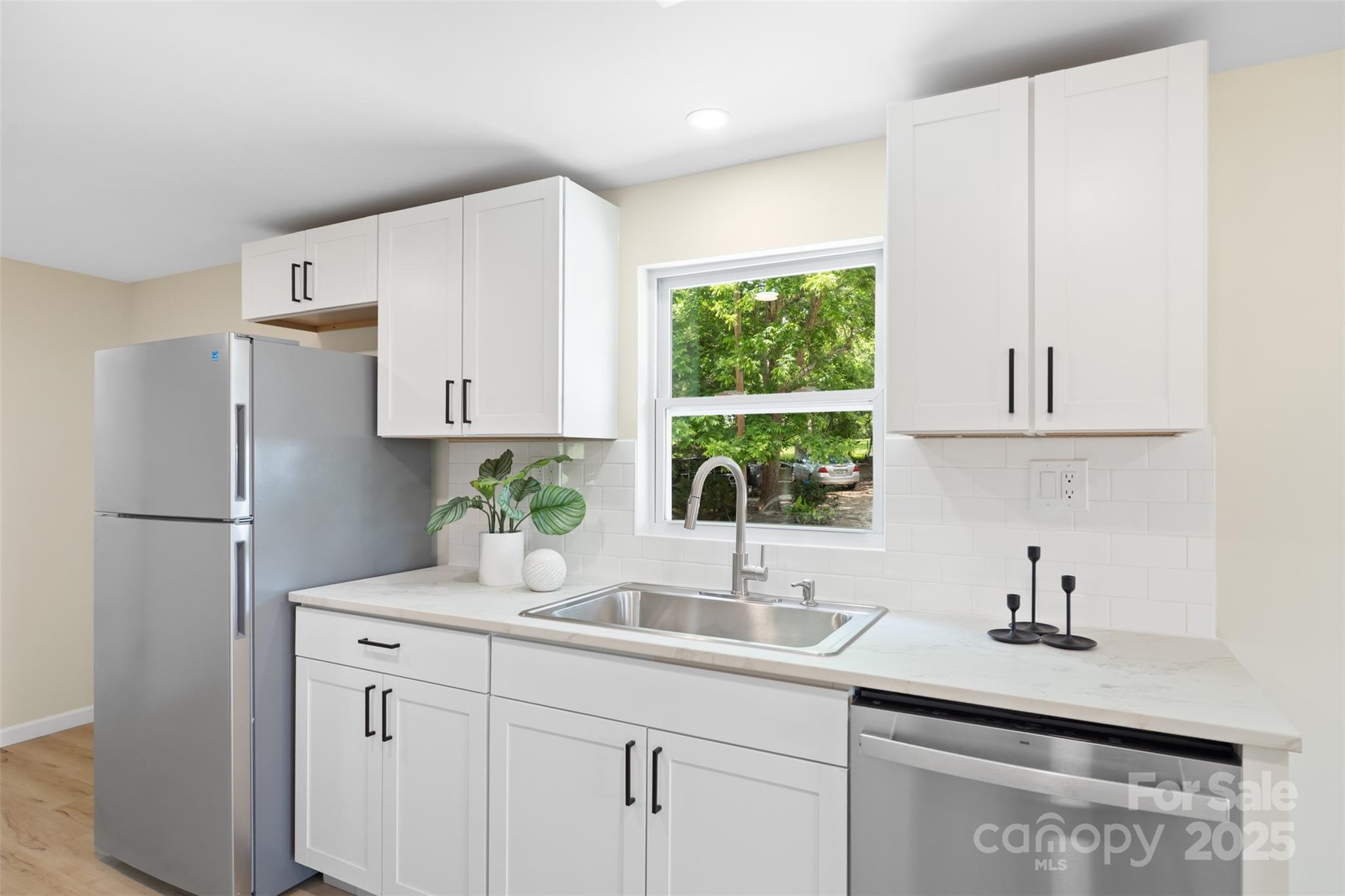 1574 Mangum Drive Lancaster, SC 29720 - Photo 9 of 22 a kitchen with stainless steel appliances a sink a window and cabinets