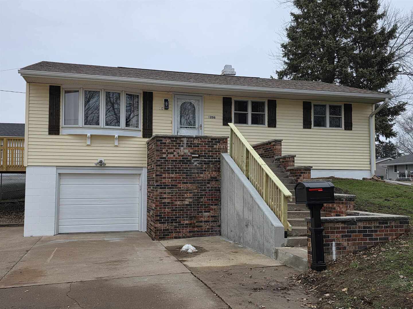 a front view of a house with garage