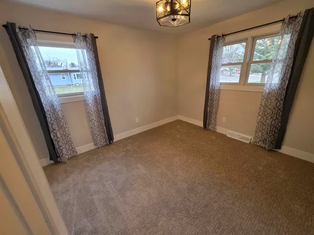 an empty room with windows