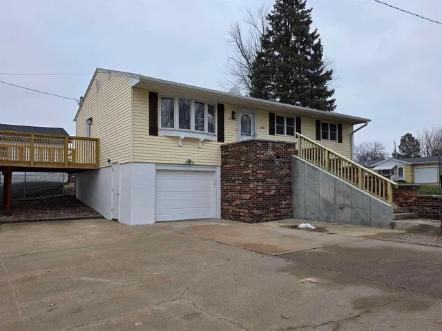 a house that has a tree in front of it
