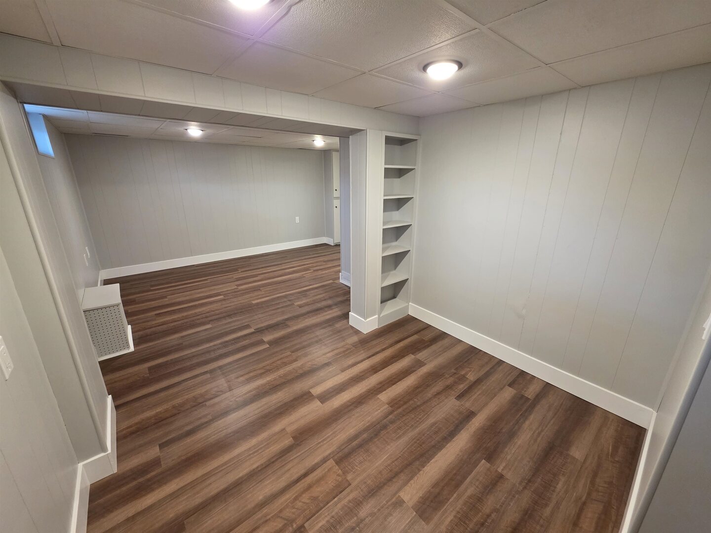 1206 10th Avenue North Clinton, IA 52732 - Photo 23 of 27 an empty room with wooden floor closet and windows
