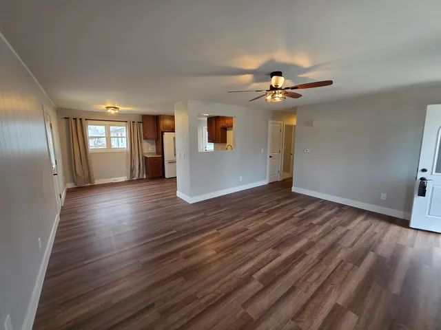 a view of a livingroom with wooden floor