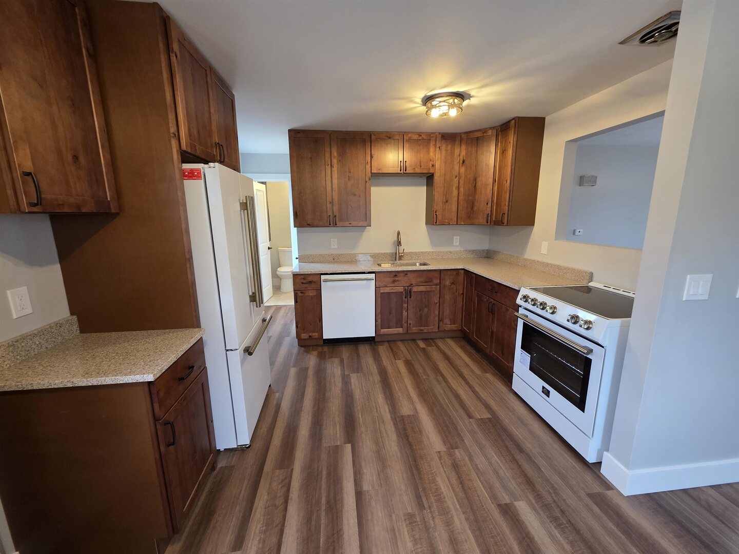1206 10th Avenue North Clinton, IA 52732 - Photo 10 of 27 a kitchen with a sink stove and refrigerator