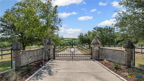 a front view of house with yard and swimming pool