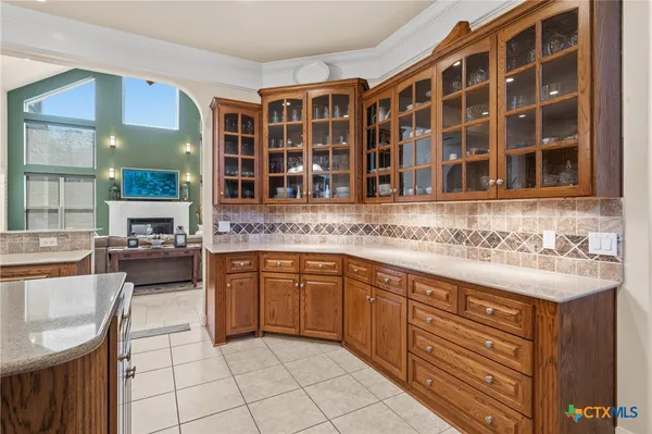 a view of a kitchen with furniture and entryway