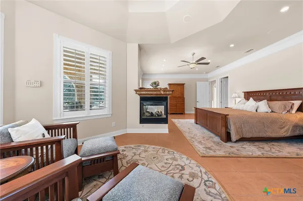 a large bathroom with a double vanity sink a large mirror and a bathtub