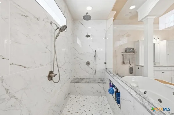 a living room with furniture wooden floor and a fireplace