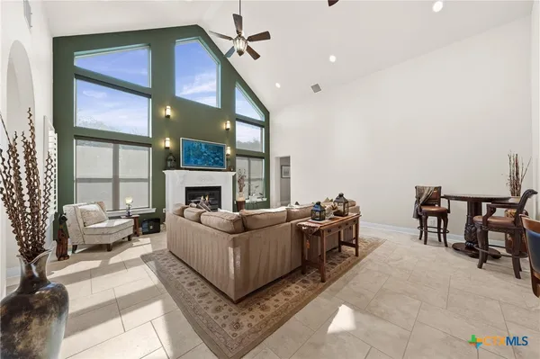 a bathroom with a toilet a sink and a window