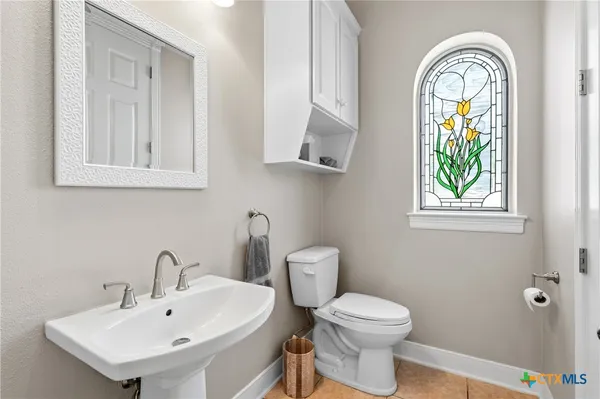 a bedroom with furniture and a flat screen tv