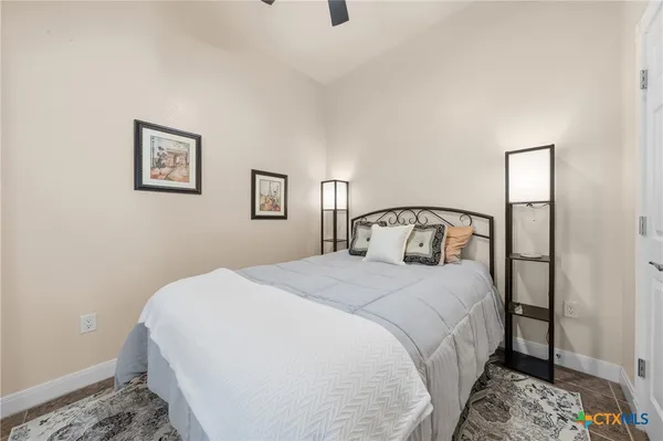 a living room with stainless steel appliances kitchen island granite countertop furniture and a couch