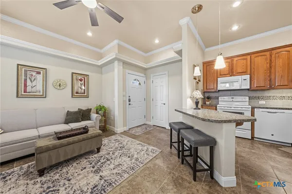 a bathroom with a toilet a sink and glass door