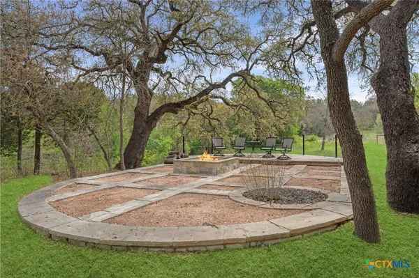 a view of a yard with trees