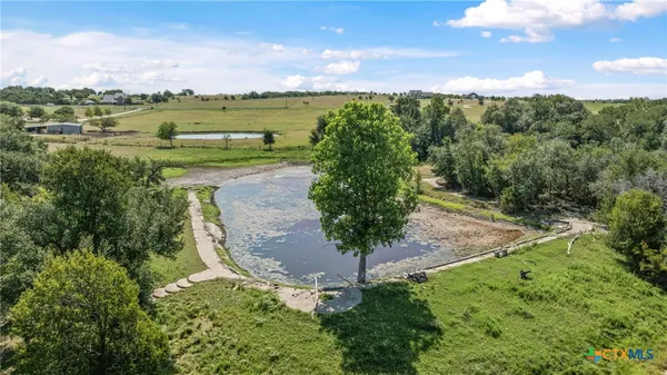 a view of a lake with a yard