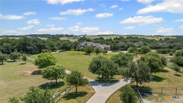 a view of a lake with houses in the back