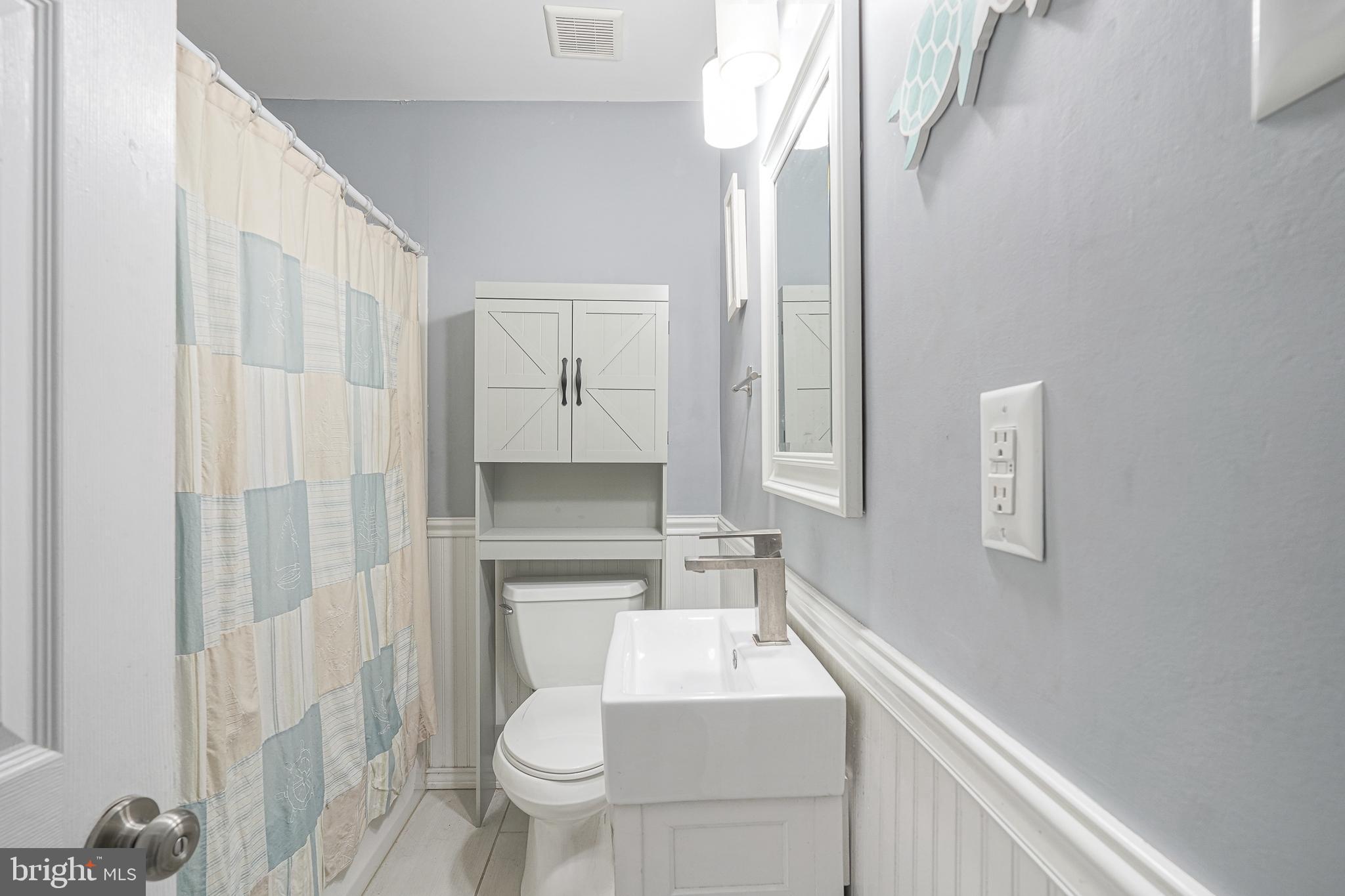35 St Charles Place Runnemede, NJ 08078 - Photo 16 of 32 a bathroom with a sink toilet and shower