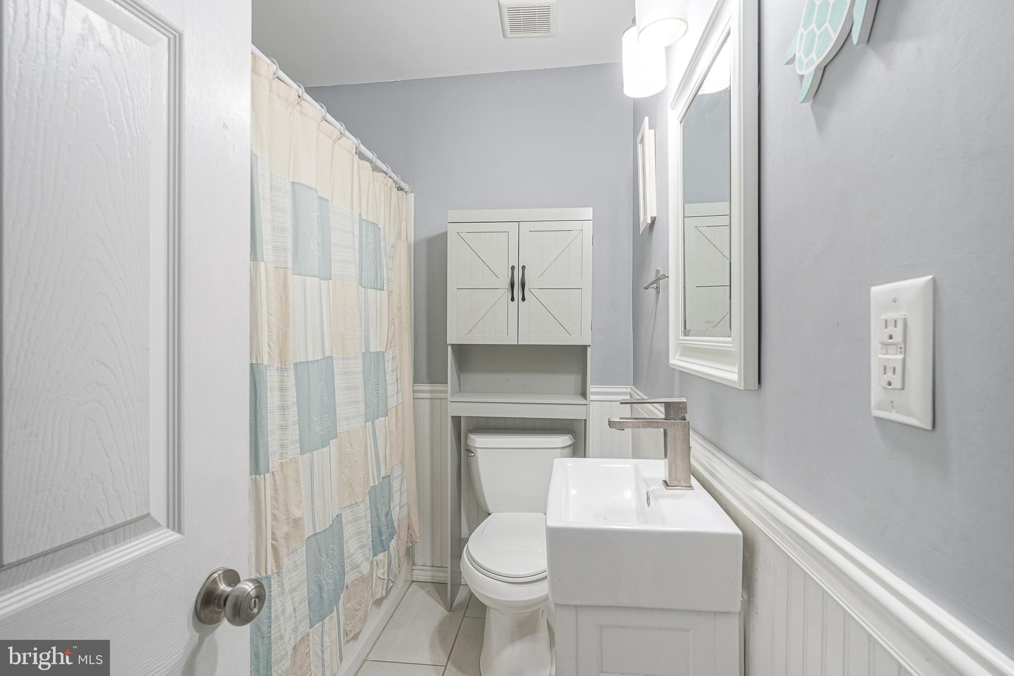 35 St Charles Place Runnemede, NJ 08078 - Photo 17 of 32 a bathroom with a sink a toilet and shower