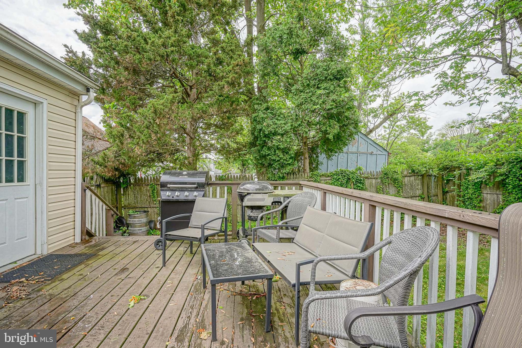35 St Charles Place Runnemede, NJ 08078 - Photo 26 of 32 a view of a deck with furniture and trees