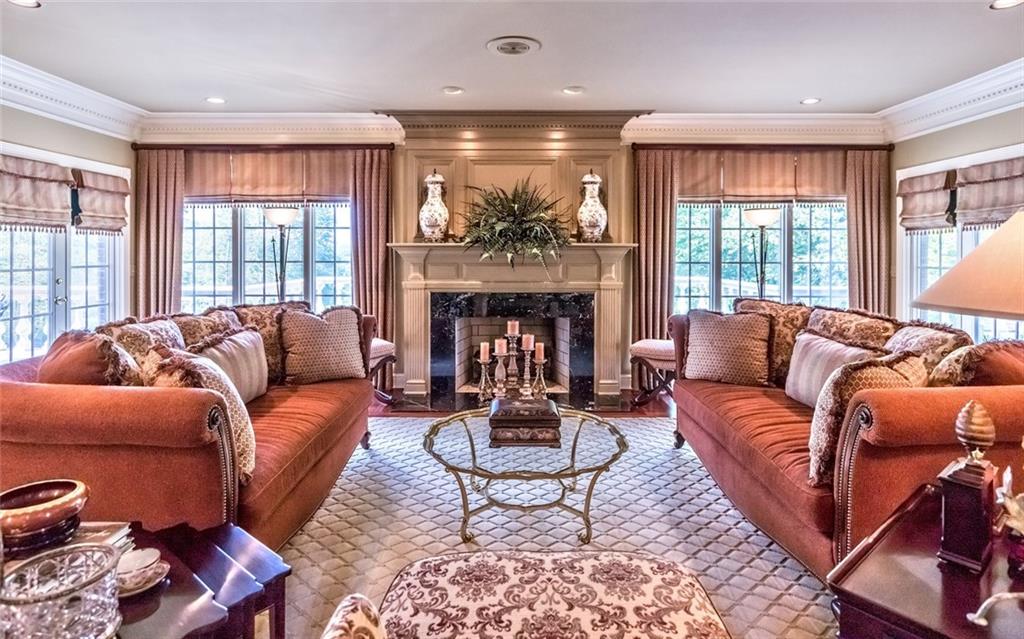 121 Buckthorn Drive Baden, PA 15005 - Photo 13 of 25 Perfect for casual entertaining, this inviting family room is directly off the kitchen, has access to rear raised patio & includes a wet bar, gorgeous gas fireplace & ceiling stereo speakers.