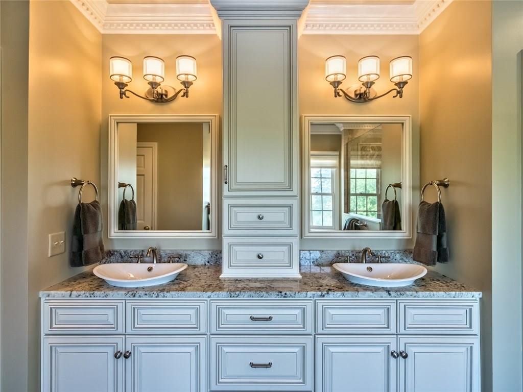 121 Buckthorn Drive Baden, PA 15005 - Photo 17 of 25 Newly remodeled master bath is perfect relaxing retreat, has double vanity with vessel sinks and white galaxy granite plus Porcelain plank floor tile.