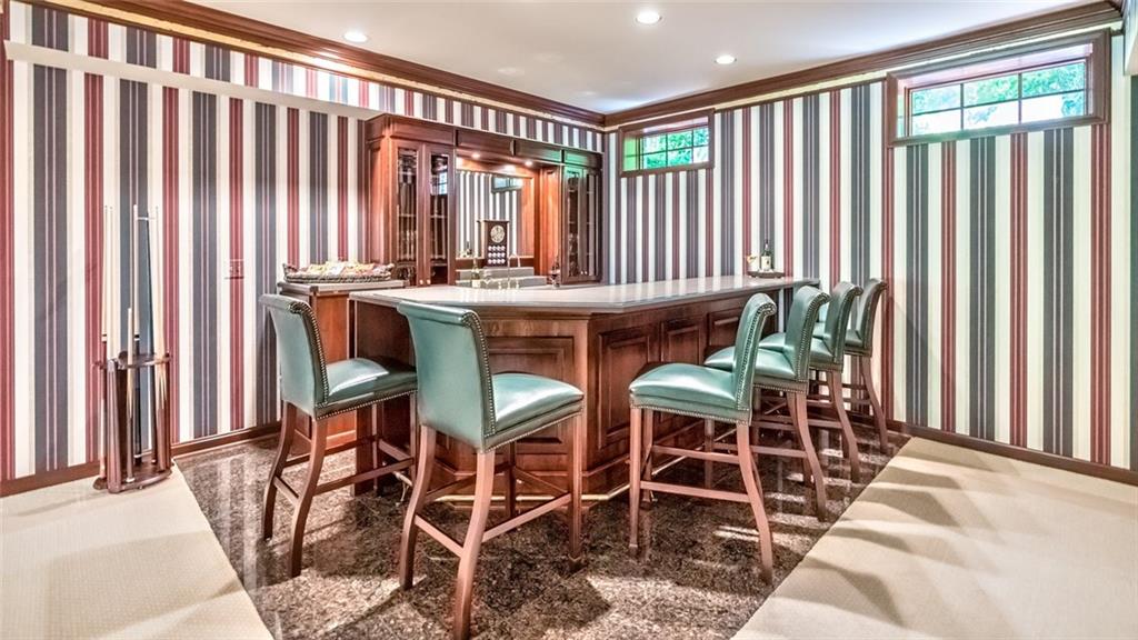 121 Buckthorn Drive Baden, PA 15005 - Photo 24 of 25 Walk behind bar with granite floor, corian counter top, beverage frig & sink