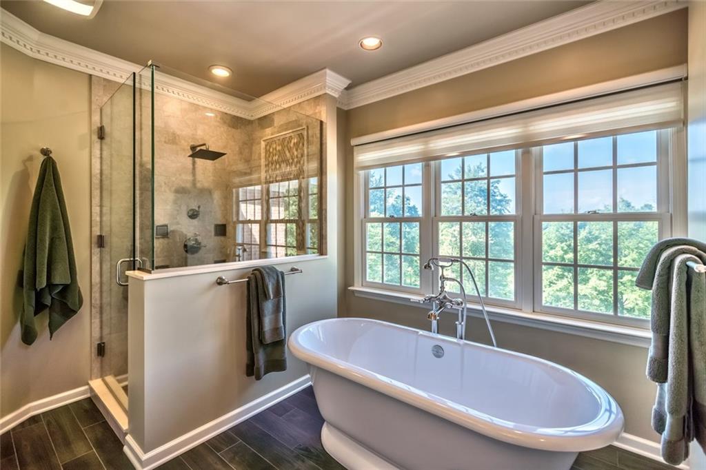 121 Buckthorn Drive Baden, PA 15005 - Photo 4 of 25 Spa shower with porcelain wall tile w/Mosaic wall feature & porcelain tile floor, Cardinal heavy glass with shower guard application, rain show head and 4 body sprays plus Victoria Albert tub and separate water closet.