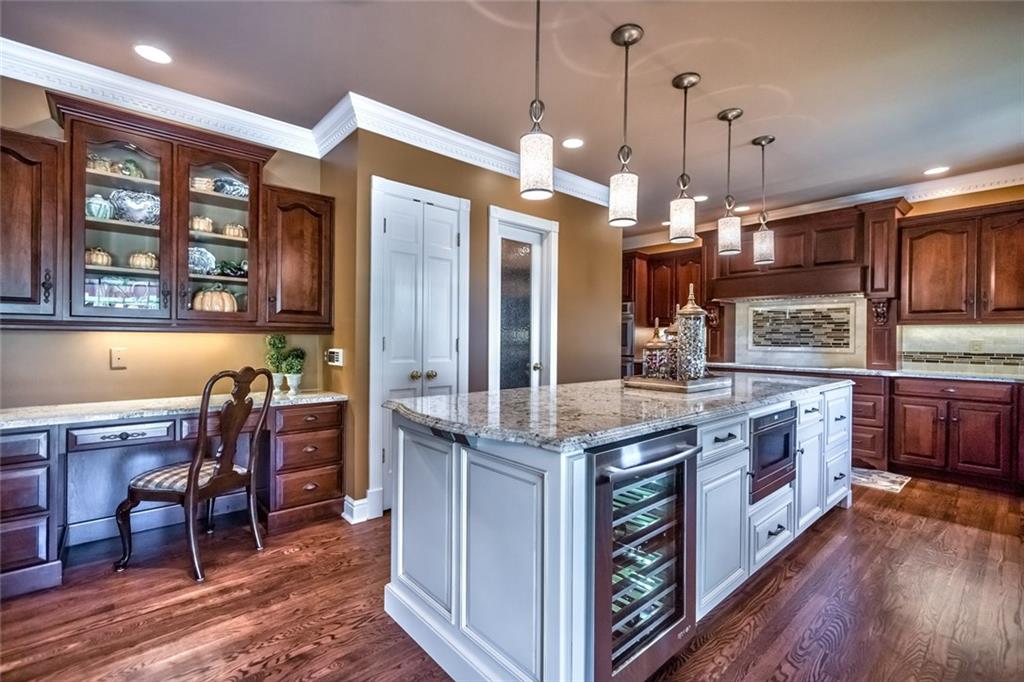 121 Buckthorn Drive Baden, PA 15005 - Photo 5 of 25 Remodeled in 2016 with entertaining in mind - wine frig, 2 beverage drawers & drawer microwave in island, convenient planning desk and breakfast area just to the left of photo.