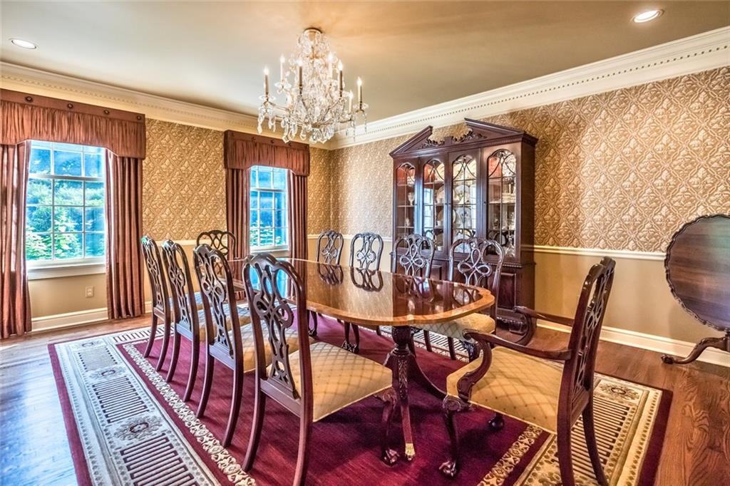 121 Buckthorn Drive Baden, PA 15005 - Photo 9 of 25 Hardwood floors and crown molding continue into this classic dining room. Entertain on a grand scale! Topped with another Francis J Nowalk crystal chandelier