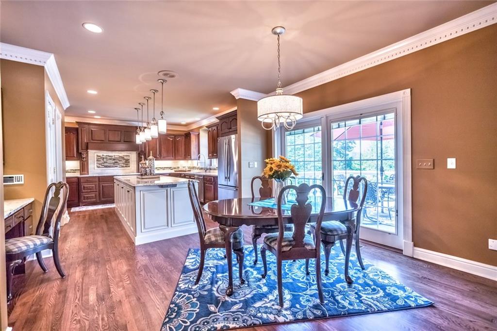 121 Buckthorn Drive Baden, PA 15005 - Photo 10 of 25 Chef's kitchen has impressive center island topped with Snowfall Granite, professional grade stainless steel Jennaire appliances & walk in pantry.