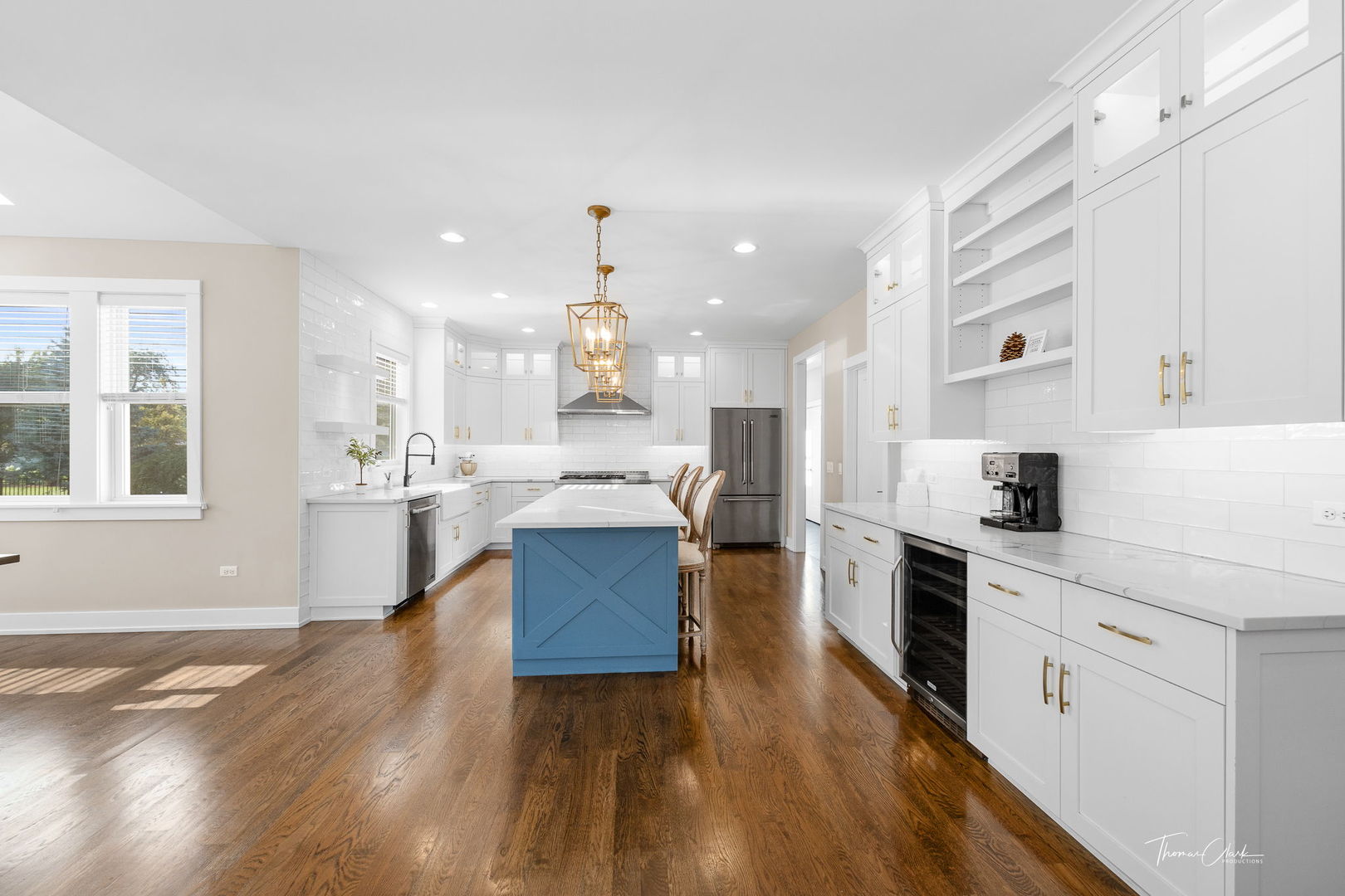 4720 Cumnor Road Downers Grove, IL 60515 - Photo 12 of 57 a kitchen with stainless steel appliances kitchen island hardwood floor sink stove and wooden cabinets
