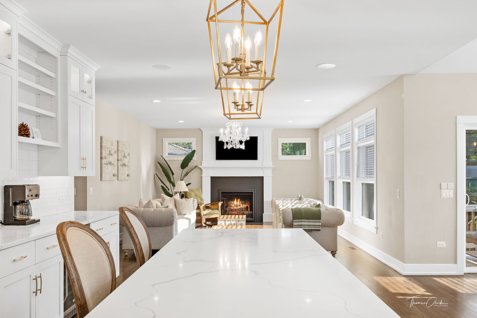 4720 Cumnor Road Downers Grove, IL 60515 - Photo 17 of 57 a living room with furniture a chandelier and a fireplace