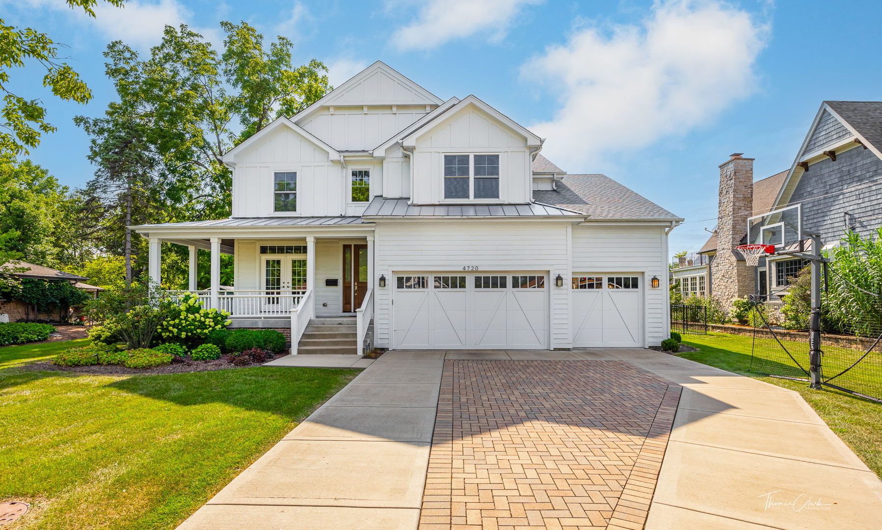 4720 Cumnor Road Downers Grove, IL 60515 - Photo 2 of 57 a front view of a house with a yard and potted plants