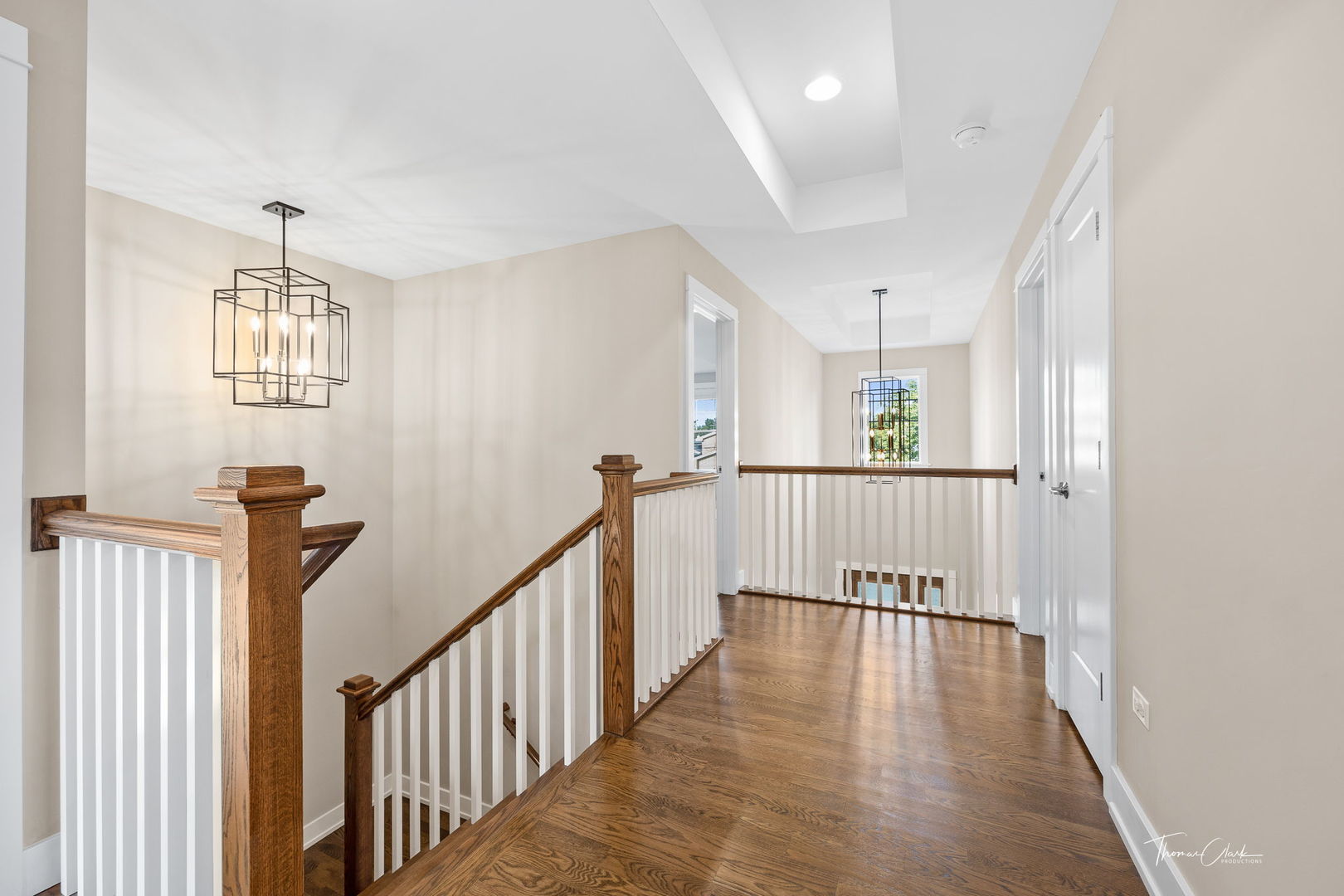 4720 Cumnor Road Downers Grove, IL 60515 - Photo 24 of 57 a view of a hallway with wooden floor and windows