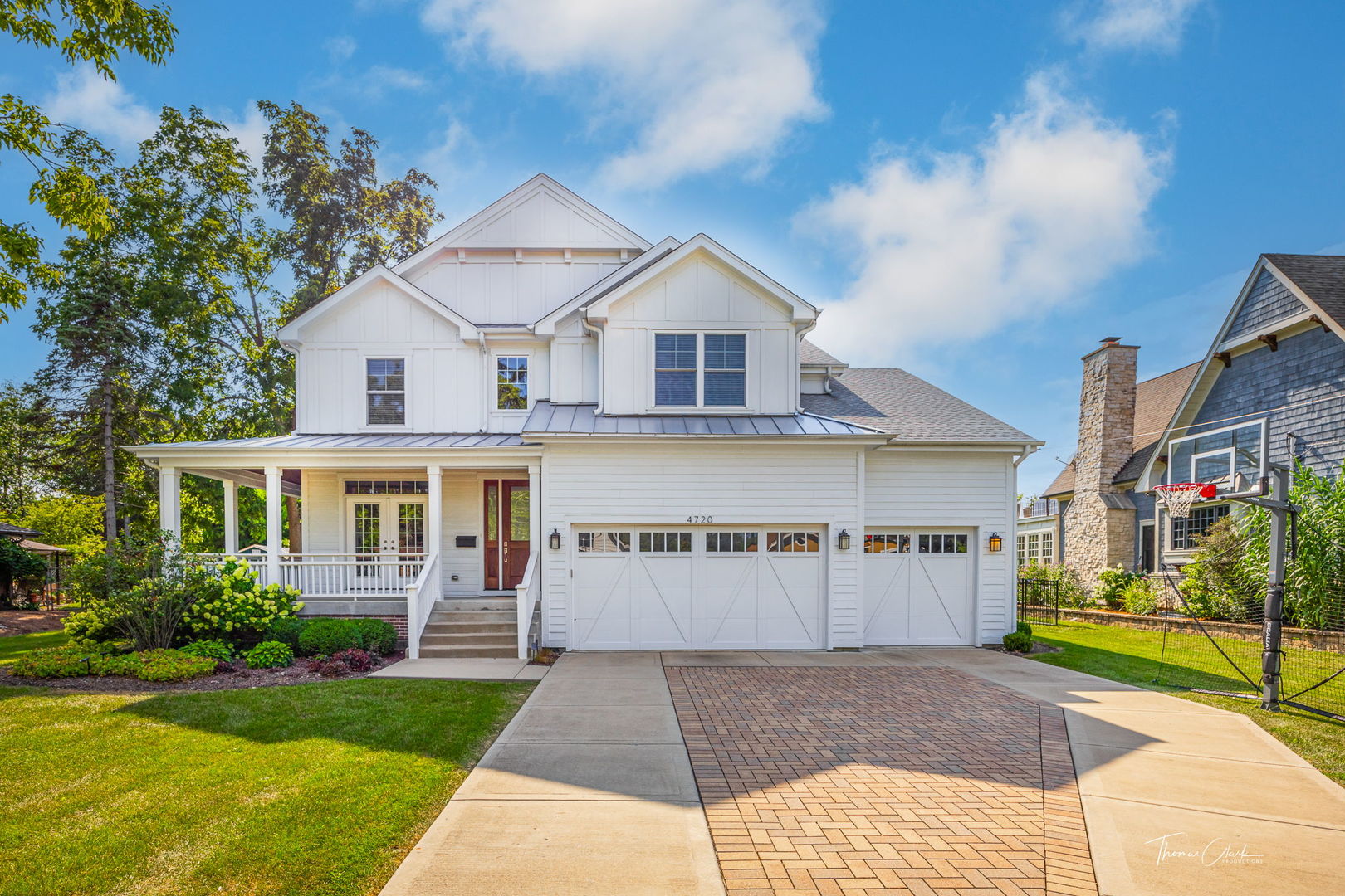 4720 Cumnor Road Downers Grove, IL 60515 - Photo 50 of 57 a front view of a house with a yard and garage