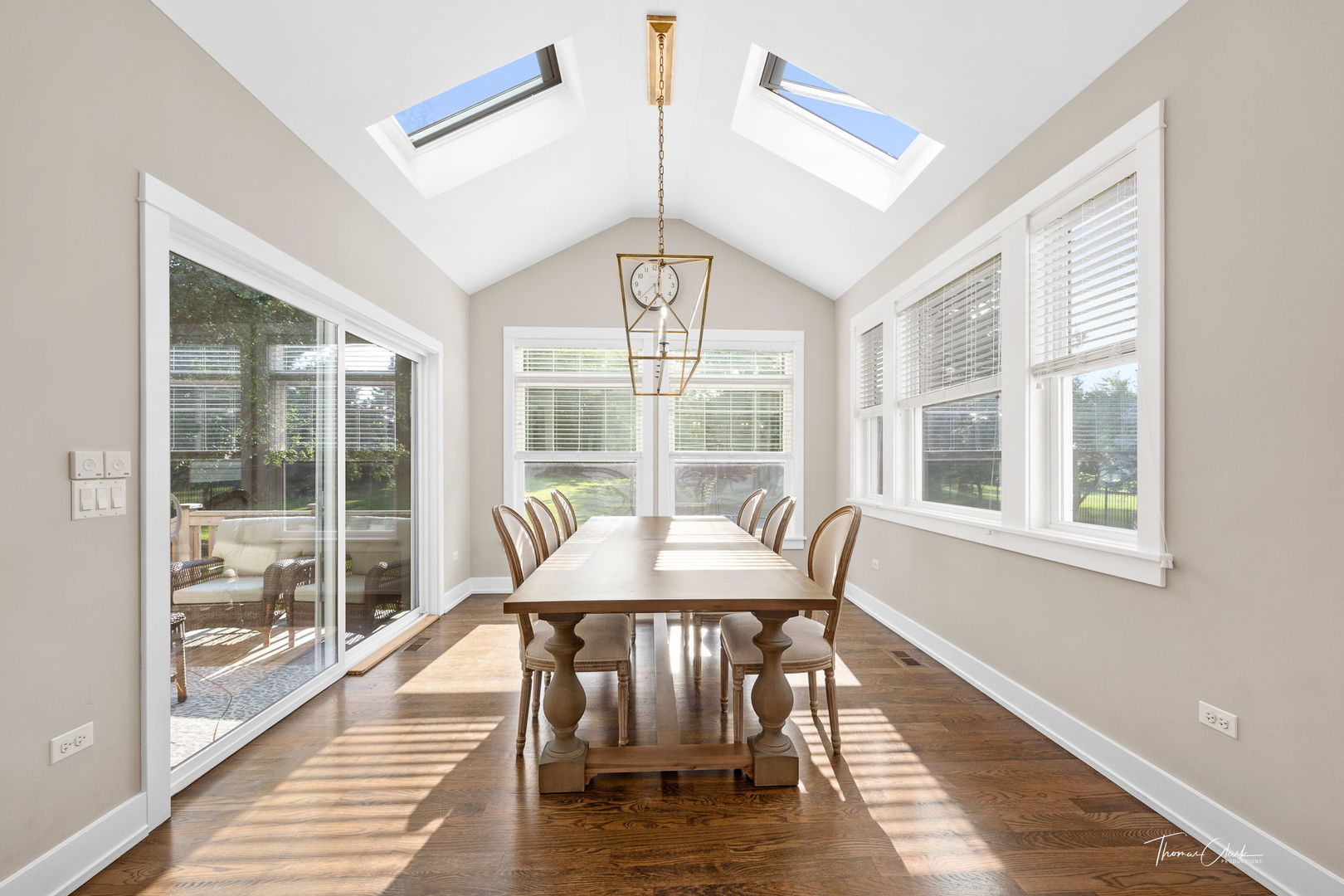 4720 Cumnor Road Downers Grove, IL 60515 - Photo 9 of 57 a dining room with wooden floor and a chandelier