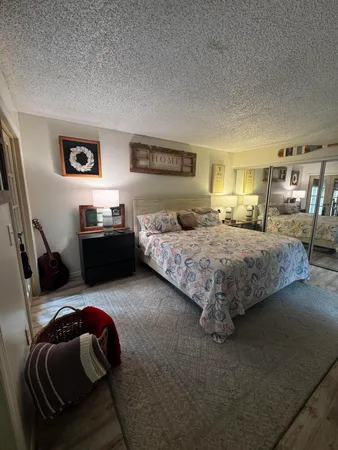 a bedroom with furniture and a bed