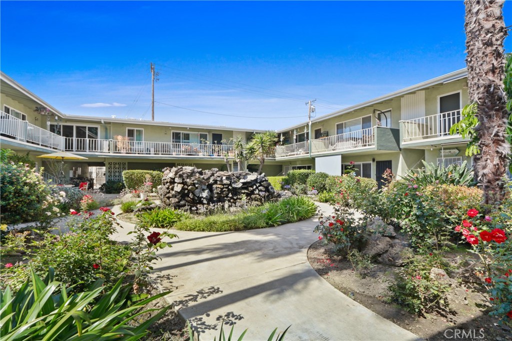 939 East Appleton Street, Unit 25 Long Beach, CA 90802 - Photo 9 of 10 a front view of a house with a yard