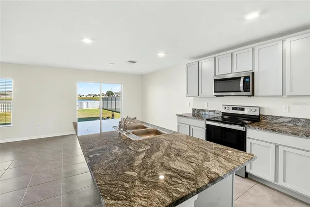 a view of an empty room with stairs