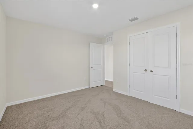 a house view with swimming pool in front of it
