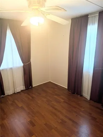 a view of a room with wooden floor and stairs