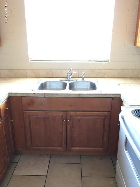 7106 North 68th Avenue, Unit 1 Glendale, AZ 85303 - Photo 11 of 22 a bathroom with a sink and a mirror