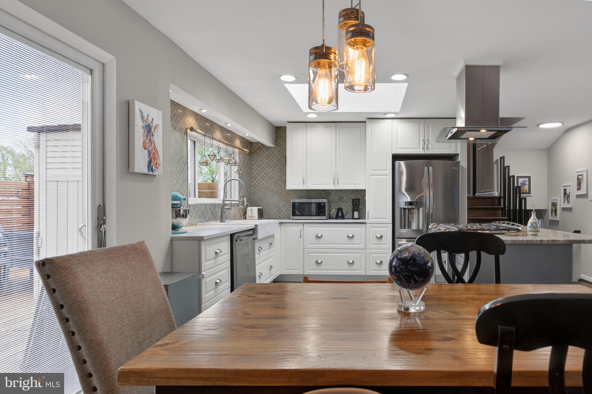 5939 Craft Alexandria, VA 22310 - Photo 11 of 54 a large kitchen with a table and chairs