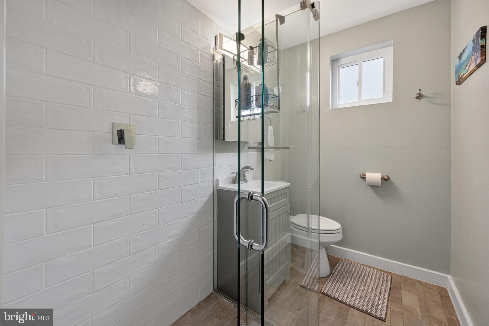 5939 Craft Alexandria, VA 22310 - Photo 18 of 54 a bathroom with a toilet and a shower