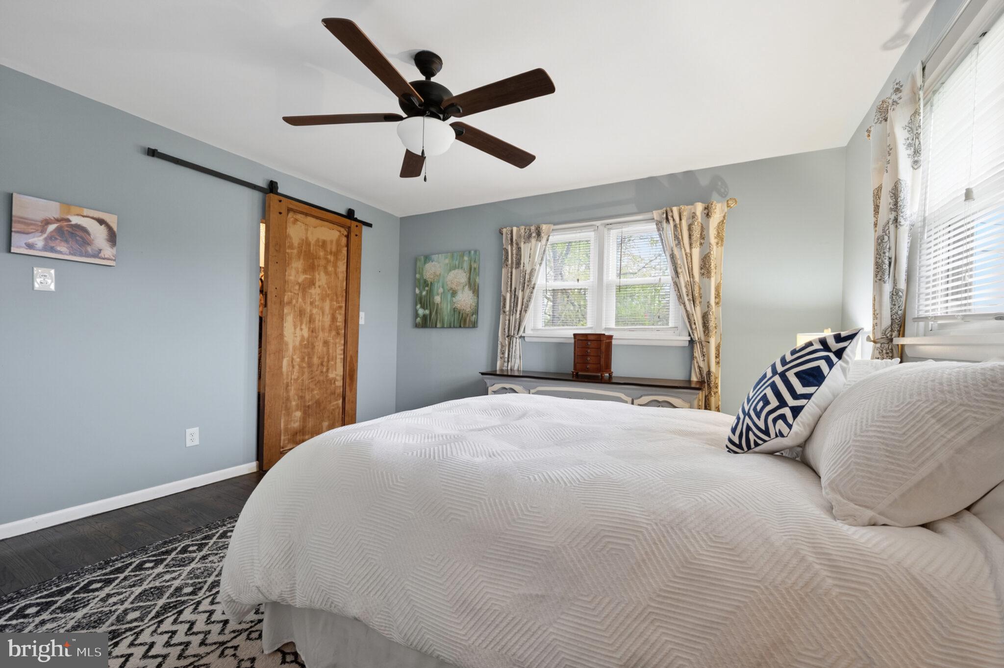 5939 Craft Alexandria, VA 22310 - Photo 20 of 54 a bedroom with a large bed and a large window