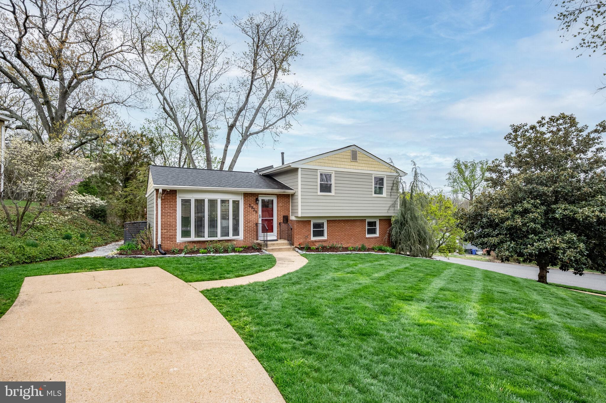 5939 Craft Alexandria, VA 22310 - Photo 40 of 54 a front view of a house with a yard and trees